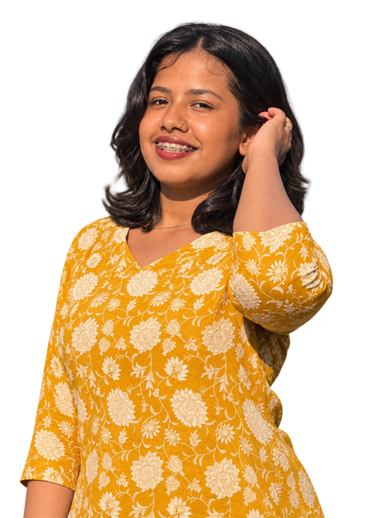 smiling woman in mustard floral kurta